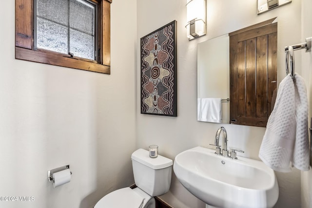 bathroom with sink and toilet