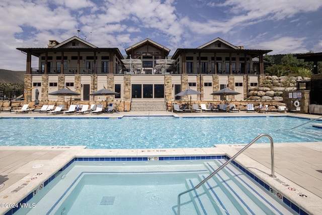 view of swimming pool featuring a patio area