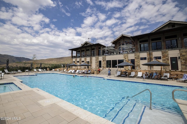 view of pool with a mountain view