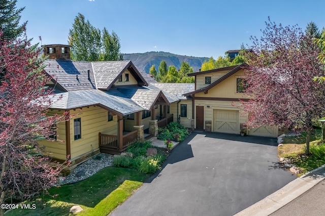 view of front of home featuring a garage and a mountain view