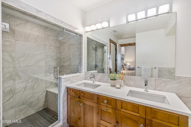 bathroom with tasteful backsplash, vanity, and walk in shower