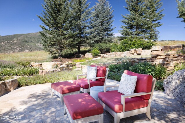 view of patio / terrace featuring a mountain view