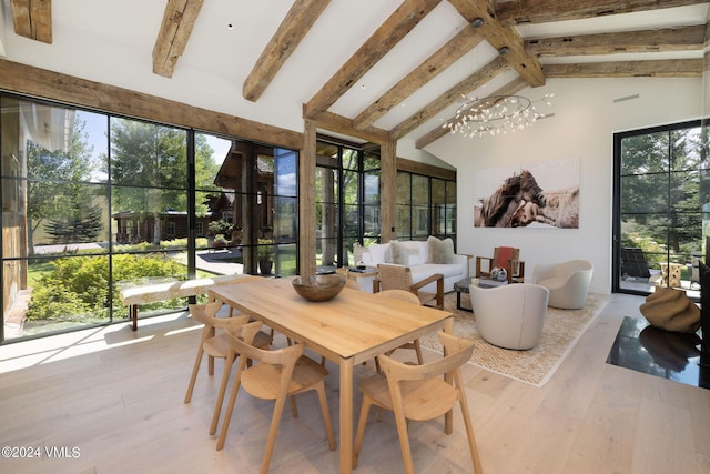 sunroom / solarium with vaulted ceiling with beams and a chandelier