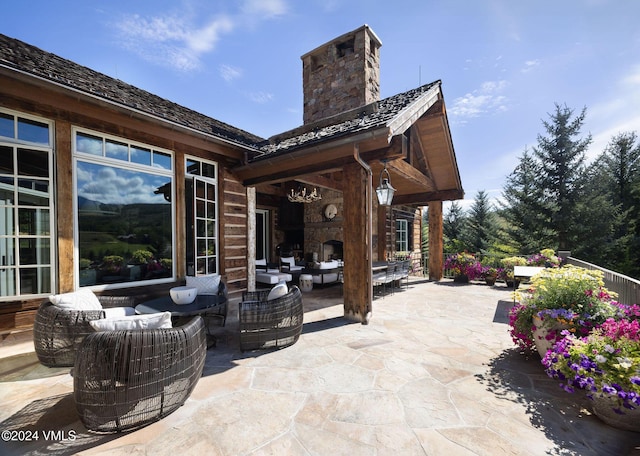 view of patio / terrace featuring an outdoor living space with a fireplace