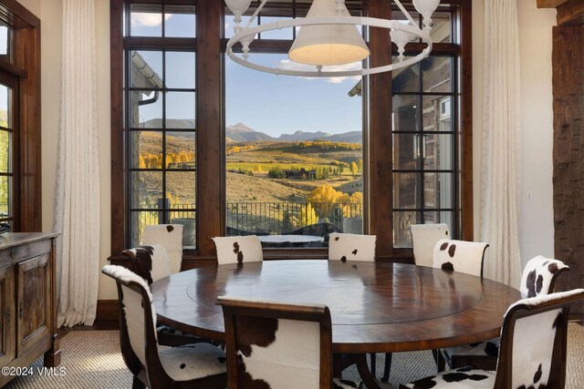 dining space featuring a mountain view and plenty of natural light