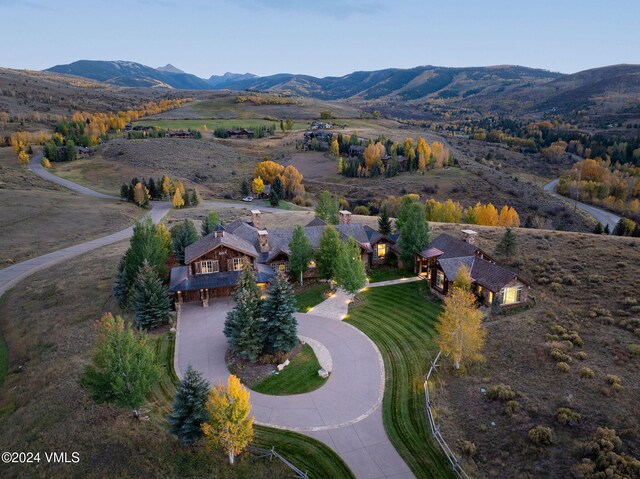 birds eye view of property with a mountain view