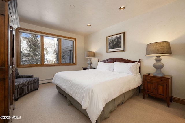 bedroom with baseboards, recessed lighting, a baseboard radiator, and light colored carpet