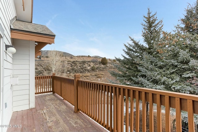 wooden deck with a mountain view