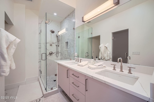 1000 Homestead Dr Unit 7, Edwards, CO 81632 - bathroom featuring double vanity and a marble finish shower