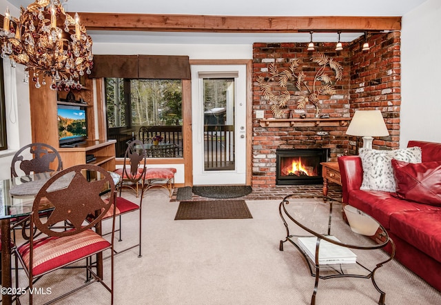 4610 Vail Racquet Club Dr Unit 7-12, Vail, CO 81657 - carpeted living room featuring a brick fireplace and a chandelier