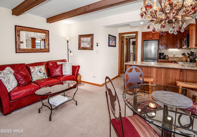 4610 Vail Racquet Club Dr Unit 7-12, Vail, CO 81657 - living area featuring light carpet, a chandelier, baseboards, and beam ceiling