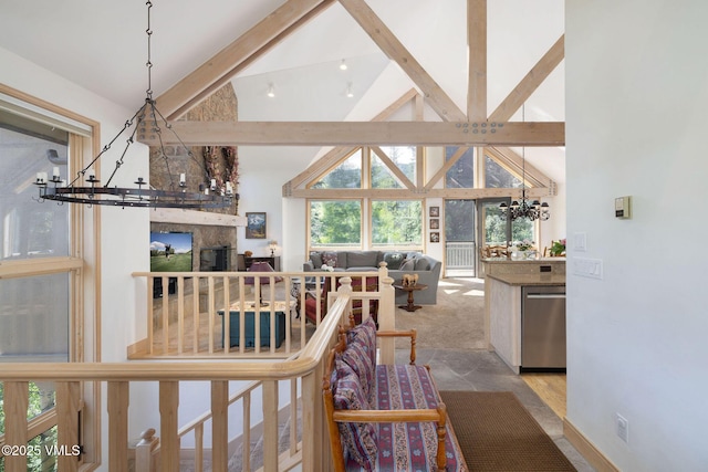 111 Scott Hill Rd Unit 17, Beaver Creek, CO 81620 - corridor featuring a chandelier, beam ceiling, and high vaulted ceiling