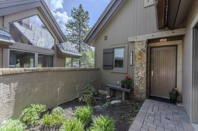 111 Scott Hill Rd Unit 17, Beaver Creek, CO 81620 - carpeted living room with high vaulted ceiling and a fireplace