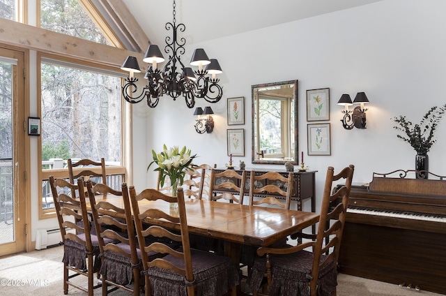 111 Scott Hill Rd Unit 17, Beaver Creek, CO 81620 - dining area featuring a baseboard heating unit, a chandelier, light colored carpet, and lofted ceiling
