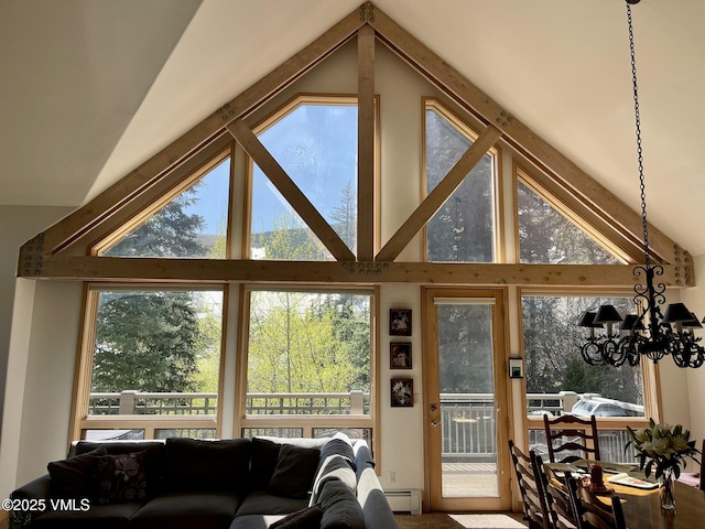111 Scott Hill Rd Unit 17, Beaver Creek, CO 81620 - sunroom with vaulted ceiling, a chandelier, healthy amount of natural light, and baseboard heating