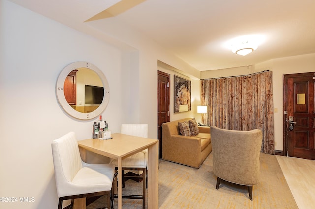 living area with hardwood / wood-style flooring