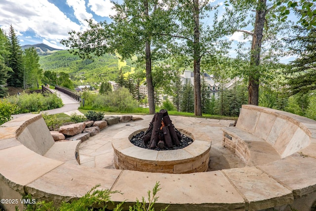 311 Offerson Rd Unit 223, Beaver Creek, CO 81620 - view of patio featuring a fire pit and a mountain view