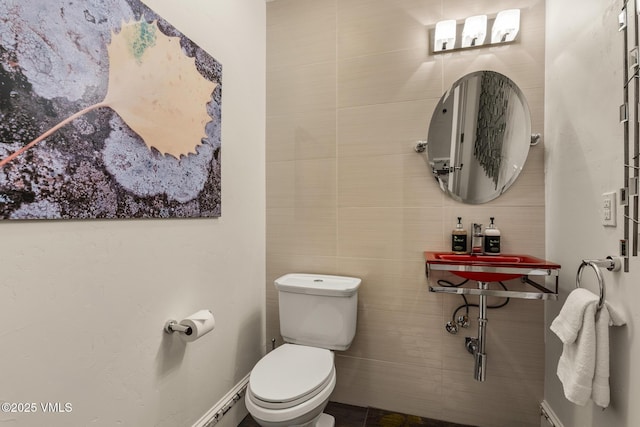 311 Offerson Rd Unit 223, Beaver Creek, CO 81620 - bathroom with toilet and tile walls