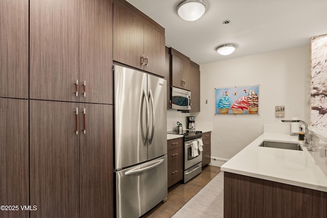 311 Offerson Rd Unit 223, Beaver Creek, CO 81620 - kitchen with stainless steel appliances, light countertops, and dark wood-style flooring