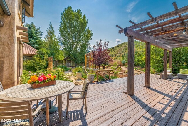 wooden terrace featuring a pergola