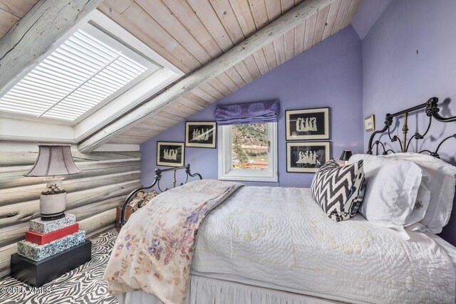 bedroom featuring vaulted ceiling with beams, log walls, and wooden ceiling