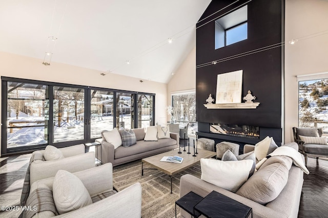 living room featuring parquet flooring and high vaulted ceiling