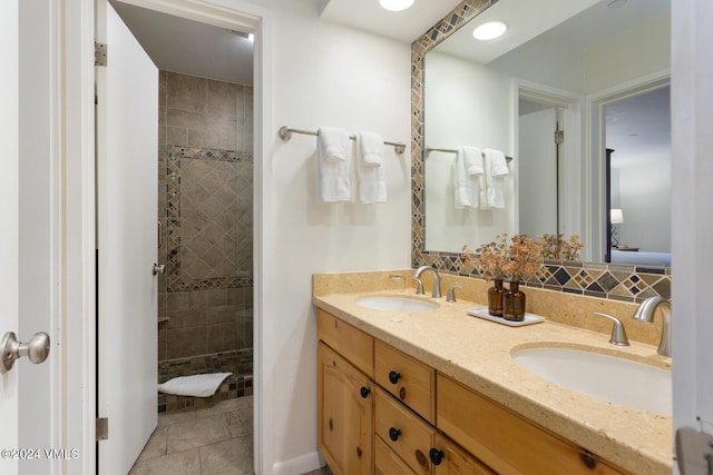 bathroom featuring vanity and a tile shower