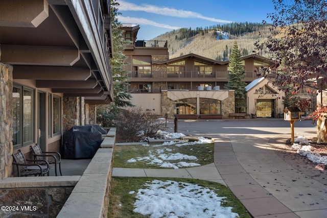 view of patio / terrace featuring a mountain view and grilling area