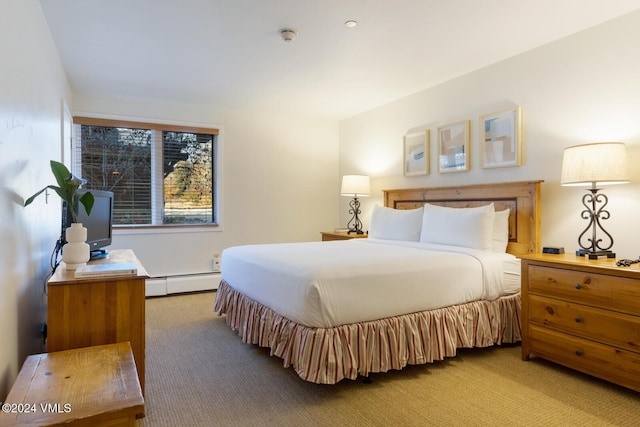 carpeted bedroom with a baseboard radiator