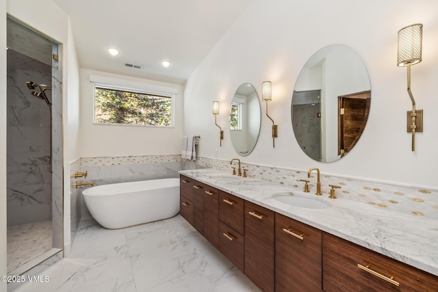 3235 Katsos Ranch Rd, Vail, CO 81657 - full bathroom featuring double vanity, a marble finish shower, a freestanding tub, and marble look tile flooring