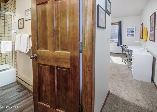 760 W Beaver Creek Blvd Unit 115, Avon, CO 81620 - full bathroom featuring vanity, bath / shower combo with glass door, wood finished floors, and decorative backsplash