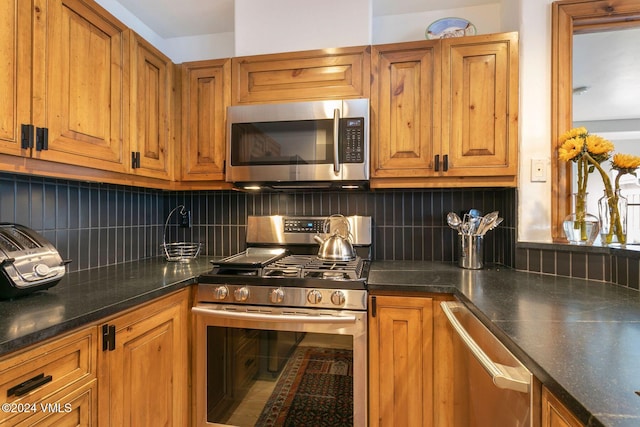 kitchen featuring stainless steel appliances and tasteful backsplash