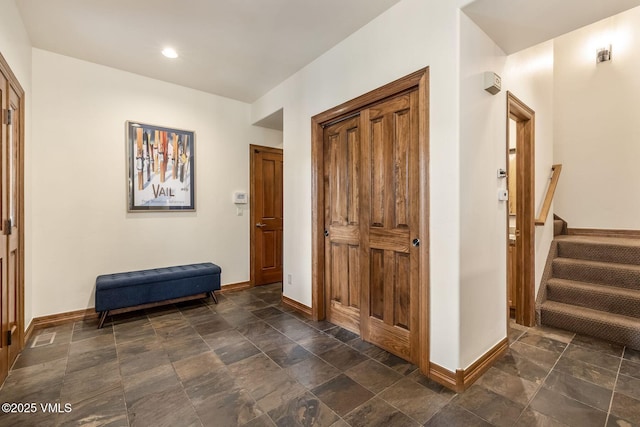 38 Millers Circle Rd, Edwards, CO 81632 - hallway featuring dark stone finish floors, stairs, and recessed lighting