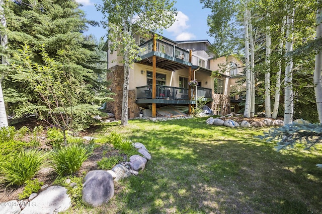 38 Millers Circle Rd, Edwards, CO 81632 - back of house with a yard, a deck, and stucco siding