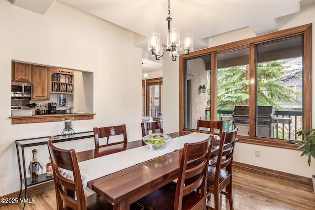 38 Millers Circle Rd, Edwards, CO 81632 - dining room with a chandelier and light wood-style floors