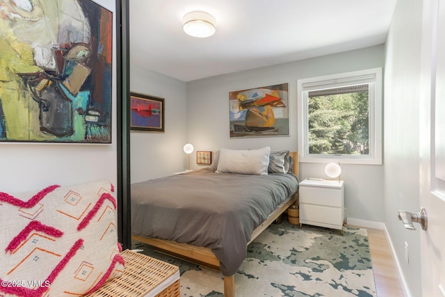 2783 Kinnikinnick Rd Unit 7, Vail, CO 81657 - bedroom with wood finished floors and baseboards