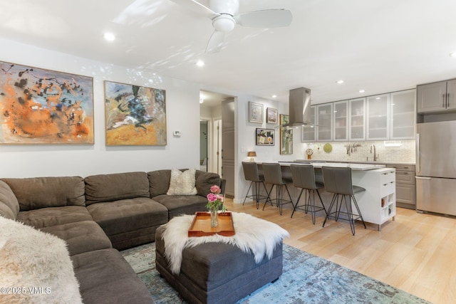 2783 Kinnikinnick Rd Unit 7, Vail, CO 81657 - living room featuring light wood finished floors, recessed lighting, and a ceiling fan