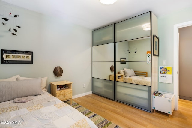 2783 Kinnikinnick Rd Unit 7, Vail, CO 81657 - bedroom with light wood finished floors and baseboards