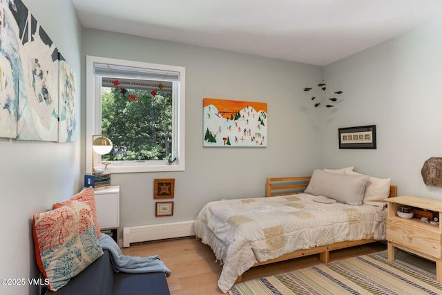 2783 Kinnikinnick Rd Unit 7, Vail, CO 81657 - bedroom featuring baseboard heating and wood finished floors
