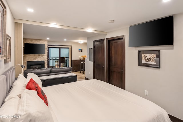 555 E Lionshead Cir Unit 207, Vail, CO 81657 - bedroom featuring a fireplace and recessed lighting