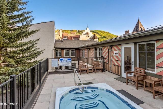 555 E Lionshead Cir Unit 207, Vail, CO 81657 - back of property with a balcony, a community hot tub, and stucco siding