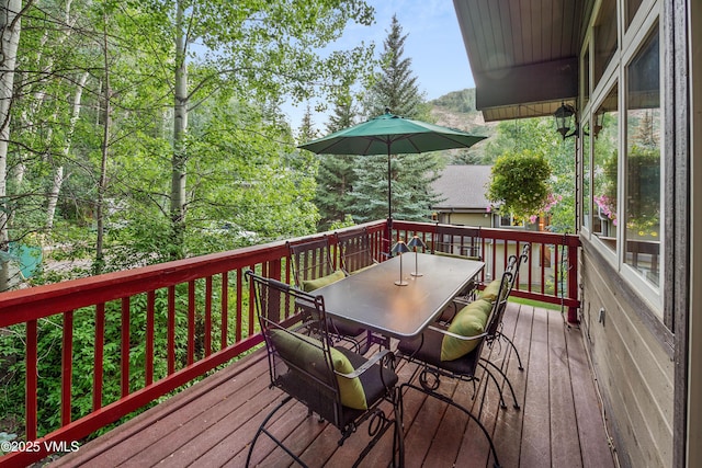 2832 Kinnickinnick Rd Unit 4, Vail, CO 81657 - wooden deck with outdoor dining space