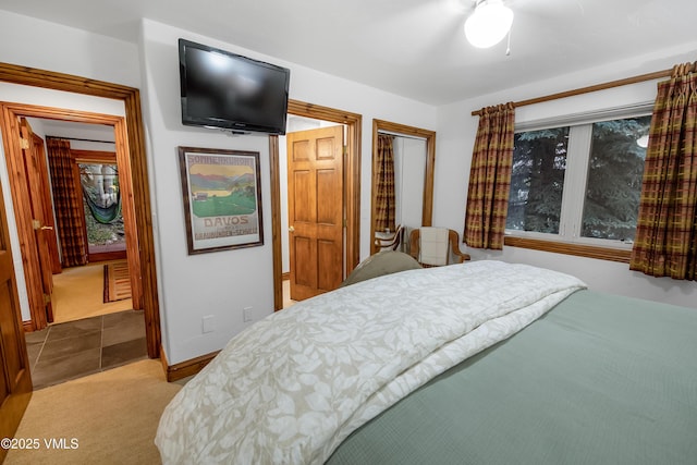 2832 Kinnickinnick Rd Unit 4, Vail, CO 81657 - bedroom with carpet floors, ensuite bath, and a ceiling fan