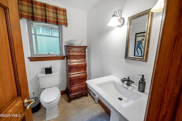 2832 Kinnickinnick Rd Unit 4, Vail, CO 81657 - half bathroom featuring toilet and a baseboard radiator