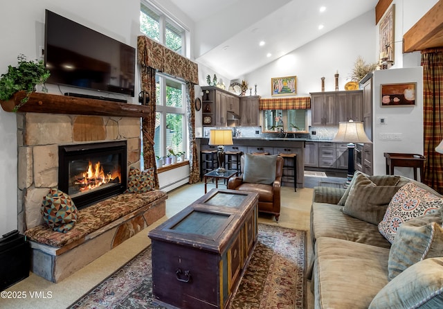 2832 Kinnickinnick Rd Unit 4, Vail, CO 81657 - living room with high vaulted ceiling, a fireplace, recessed lighting, and a baseboard radiator