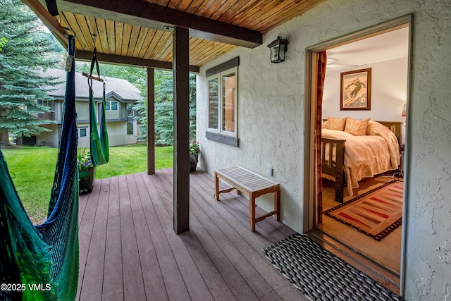 2832 Kinnickinnick Rd Unit 4, Vail, CO 81657 - wooden terrace featuring a lawn