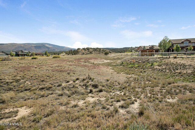 property view of mountains featuring a rural view