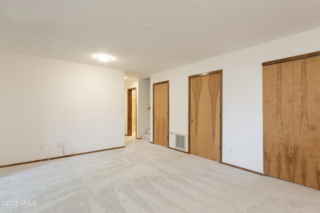 717 Bull Run Unit A, Eagle, CO 81631 - unfurnished bedroom with two closets and carpet