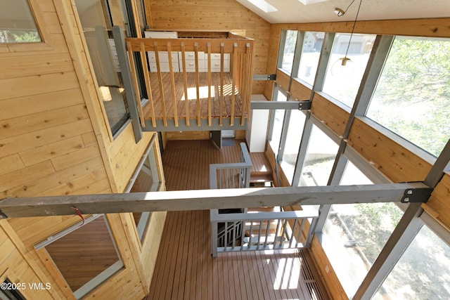 717 Bull Run Unit A, Eagle, CO 81631 - stairway featuring a skylight, lofted ceiling, and wood walls