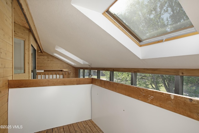 717 Bull Run Unit A, Eagle, CO 81631 - hall with a skylight, wooden walls, and vaulted ceiling